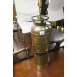 A BRASS AND COPPER FIRE EXTINGUISHER, in the form of a table lamp, enscribed Chief Croker New York.