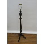 A GEORGIAN STYLE MAHOGANY CARVED STANDARD LAMP on tripod support with pad feet 165cm (h)