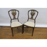 A SET OF 4 LATE 19TH CENTURY MAHOGANY AND MARQUETRY INLAID SINGLE CHAIRS the shaped open backs with