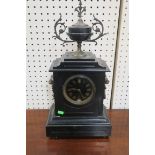 A VICTORIAN BLACK MARBLE MANTLE CLOCK of rectangular form the stepped top headed by a brass mounted