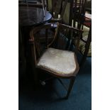 AN EDWARDIAN MAHOGANY AND INLAID CORNER CHAIR, with pierced vertical splats and upholstered seat,