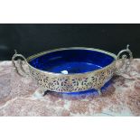 AN 18TH CENTURY SILVER PLATED DISH OF OVAL OUTLINE with foliate pierced frame scrolled arms and