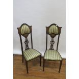 A PAIR OF EARLY 20TH CENTURY MAHOGANY AND MARQUETRY INLAID TALL BACK CHAIRS the shaped top with an