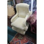 A PAIR OF BEIGE UPHOLSTERED NURSING CHAIRS