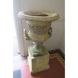 A FINE PAIR OF COMPOSITION SANDSTONE URNS, each of semi-lobed campana form,