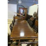 A GOOD MAHOGANY DINING TABLE, the rectangular top with gadrooned rim and two loose leaves,