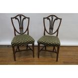 A PAIR OF 19TH CENTURY MAHOGANY SINGLE CHAIRS the shield shaped backs centered by a pierced feather