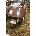 A GEORGIAN STYLE MAHOGANY OVAL TOP DINING ROOM TABLE plain top with moulded rim and recessed frieze