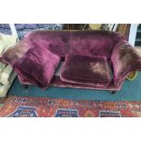 A VELVET UPHOLSTERED TWO SEATER SOFA,