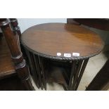 AN EDWARDIAN MAHOGANY NEST OF THREE TABLES,