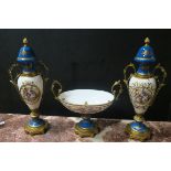 A CONTINENTAL PAINTED PORCELAIN AND GILT BRASS MOUNTED GARNITURE comprising a pair of two handled