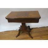 A REGENCY STYLE FOLD OVER TOP TABLE the rectangular quarter veneered and marquetry in laid top