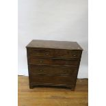 A GEORGIAN MAHOGANY CHEST OF DRAWERS with rectangular top and moulded rim above two short and three