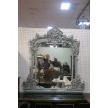 AN 18TH CENTURY CONTINENTAL STYLE GREY PAINTED OVERMANTLE MIRROR the rectangular compartmented