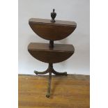 A MAHOGANY TWO TIER DROP LEAF DUMB WAITER, surmounted with a neo-classical urn,