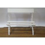 A PAIR OF WHITE PAINTED CAST IRON GARDEN SEATS the frames modelled as tree bough applied with