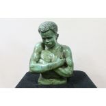 A GREEN PATENATED BUST OF AN AFRICAN MALE on a rectangular plinth 60cm (h)