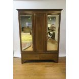 A MAHOGANY AND MARQUETRY INLAID THREE DOOR WARDROBE,