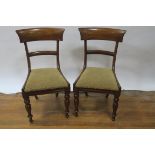 A SET OF SIX VICTORIAN MAHOGANY DINING CHAIRS each with a curved top rail above an upholstered top