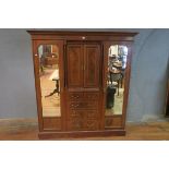 A GEORGIAN STYLE FLAME MAHOGANY AND MARQUETRY INLAID DOUBLE WARDROBE,