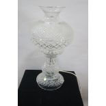 A WATERFORD CRYSTAL TABLE LAMP the circular diamond cut and cross hatched waisted frame headed by