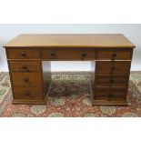 A 20TH CENTURY MAHOGANY FRAMED PEDESTAL DESK the rectangular top with moulded rim,