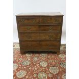 A GEORGIAN MAHOGANY CHEST OF DRAWERS with rectangular top and moulded rim above two short and three