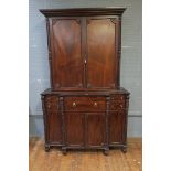 A REGENCY STYLE MAHOGANY BUREAU BOOKCASE the rectangular raised top with moulded corners above a