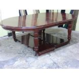 A good quality mahogany wind out oval dining table in the Victorian style with two leaves, turned