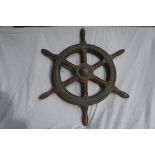 A brass and hardwood yacht's wheel with six turned spindles, Diameter 24ins