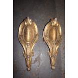 Pair of carved gilt wood scroll shaped corner mouldings. Height 18.5 ins.