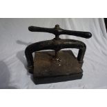 A Late 19thC iron book press, Height 13ins, Width 15.5ins, Diameter 10ins