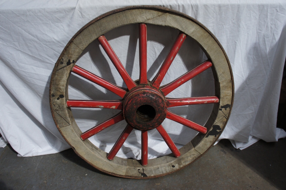 A painted cart wheel with iron tyre, Diameter 34ins