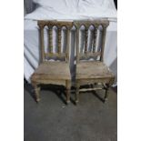 Pair of 19thC mahogany spindle back hall chairs with solid seats and turned legs