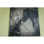 Simon Buttimore monochrome photograph of Simon nuzzling with his horse on cavas, 32 x 32ins