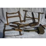 Collection of old wood working tools including saws, chisels etc