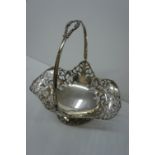 A GV pierced swing handled silver bonbon basket London 1913 maker Mappin & Webb 11ozt