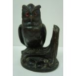 Black Forest carved inkwell in the form on an owl with orange and black glass eyes. (in need of