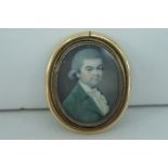 Oval portrait miniature of a gentleman in a green jacket, 1.5 X 1.25ins