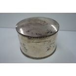 A circular silver box with reeded borders, Chester 1938 17 1/2 ozt, maker S&I