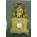 19thC French ormolu mantel clock with decoration of figures in an arbour above, striking on a