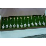 Limited edtition collection of twelve gold on silver flower spoons cased with letter from John