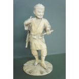 Late 19thC Japanese carved ivory figure of a man with a sledge on his back. Ht. 8 ins., signature to
