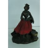 19thC bronze desk ornament in the form of a young woman with basket and hat box etc signed A. Giboux