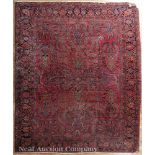 Heriz Carpet, crimson and navy ground, center field with repeating floral motif, palmette border,