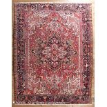 Persian Heriz Carpet, red ground, central medallion, stylized floral border, 8 ft. 4 in. x 11 ft.