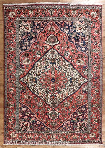 Persian Bactairie Carpet, red, cream and blue ground, central medallions, overall floral design, 6