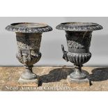 Pair of American Cast Iron Campagna Urns, 19th c., foliate design, lion mask handles, h. 24 in.,