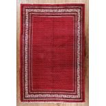 Botemir Carpet, c. 1950, Iran, red ground, blue repeating designs, 7 ft. 4 in. x 11 ft