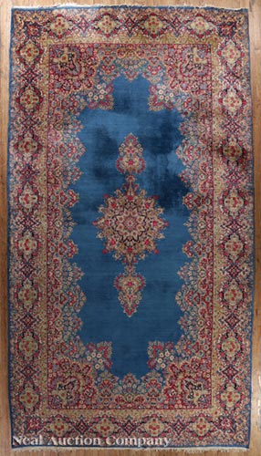 Heriz Carpet, central astral blue ground with central medallion and spandrels, stylized burgundy